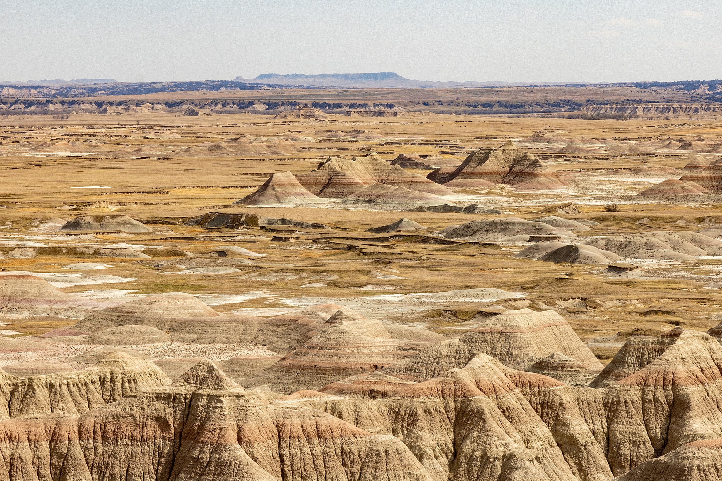 Badlands in Heat — Spring Light Across the Edge of Time