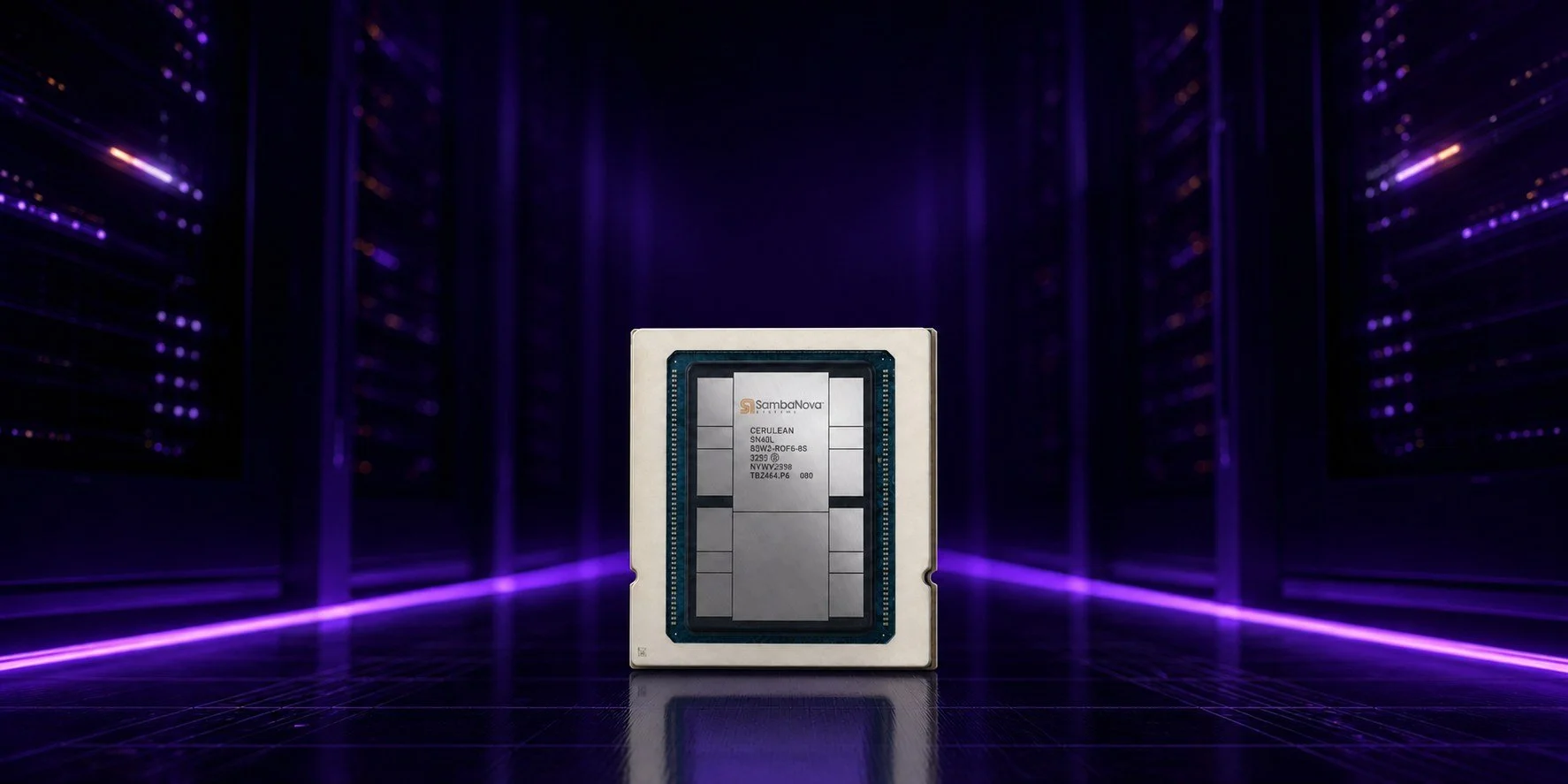 A computer processor chip in a server room with purple lighting.