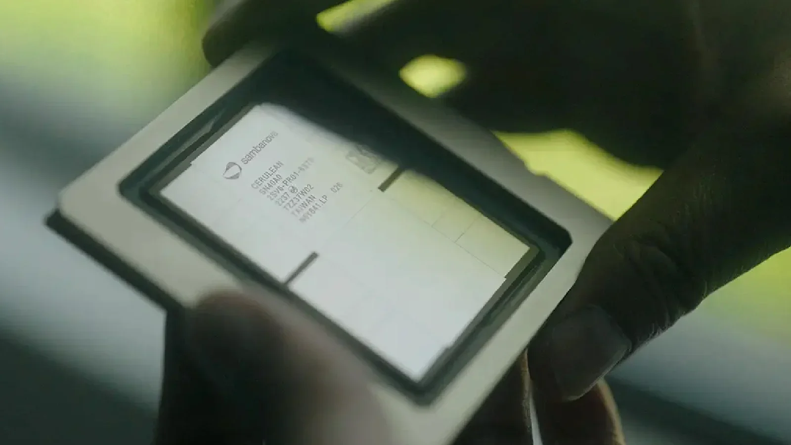 Close-up of a handheld device displaying a transaction receipt from Santander bank for a car purchase.