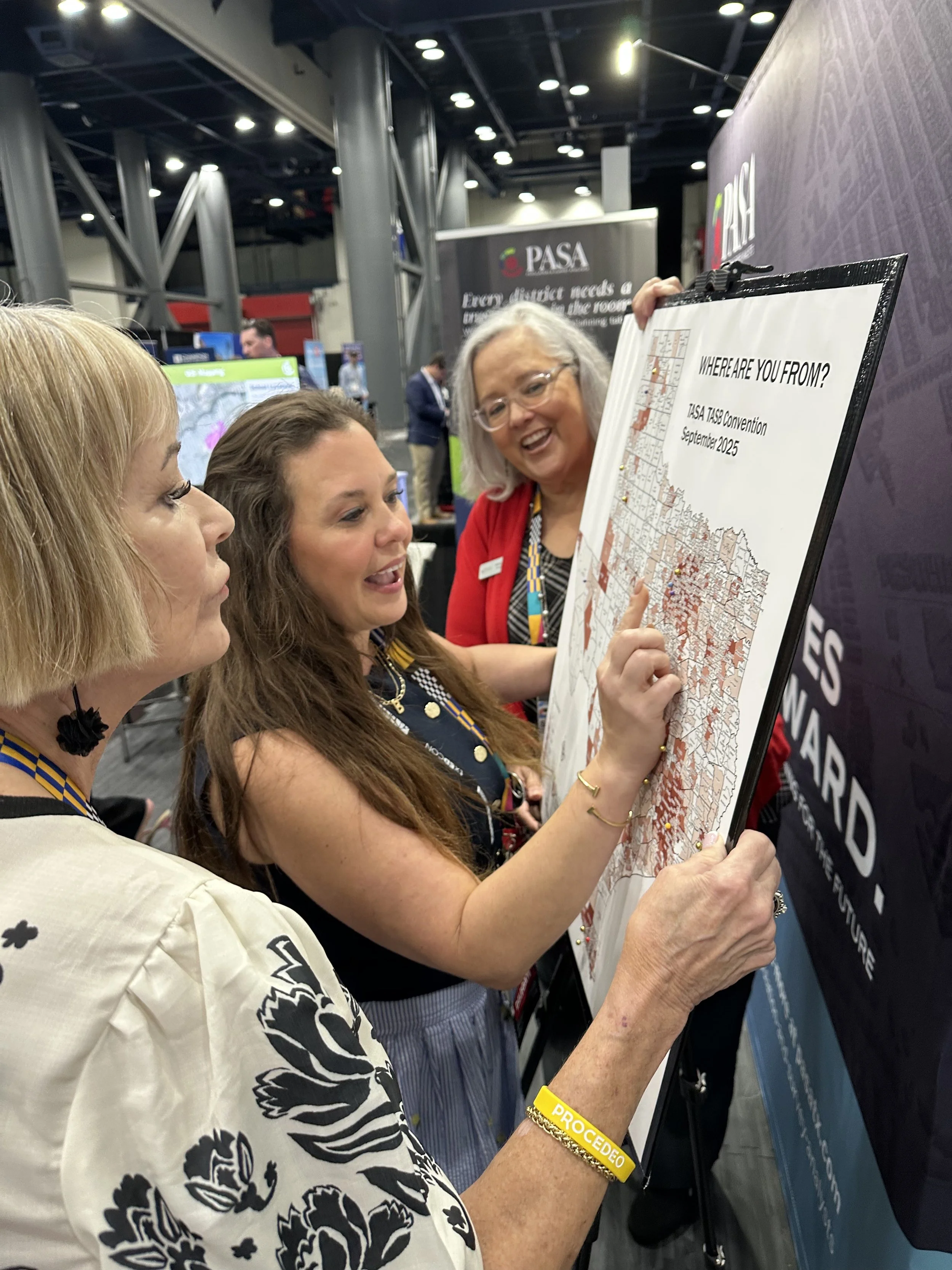 SC and attendees at booth.jpg