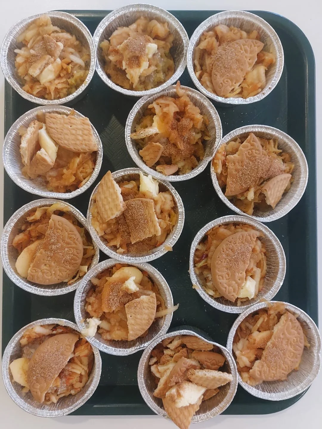 We made Apple Biscuit Pies today! While of course it&rsquo;s fun (and delicious) to cook, making these pies today allowed the children to work on their fine motor skills by mastering grating the apples, sifting the cinnamon and sugar, transferring an