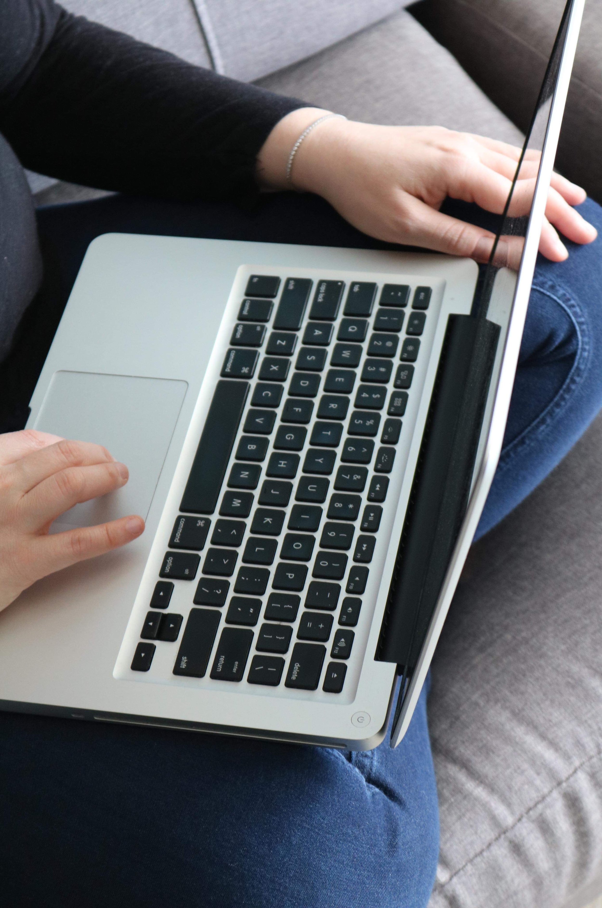 Elaine Alexander working at a laptop