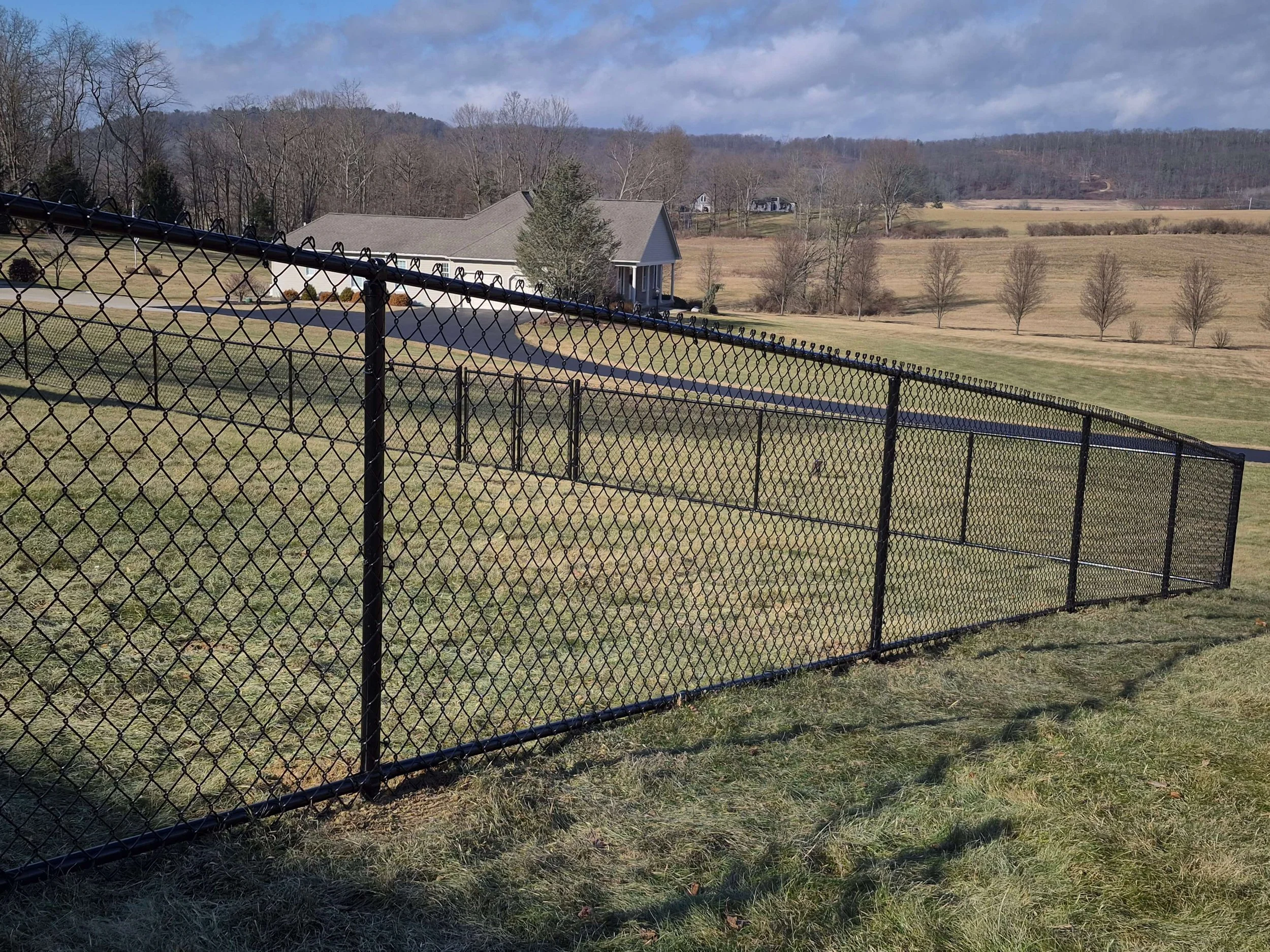 Chainlink fence installation in backyard