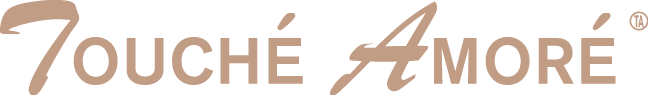 Logo of Touché Amoré with stylized text in beige and brown colors.