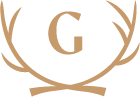 A white circular emblem with a gold letter G and gold antlers surrounding it.