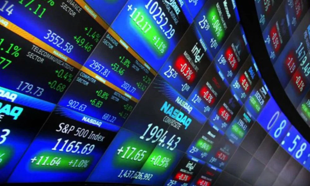 A wall of screens that display the stock market.