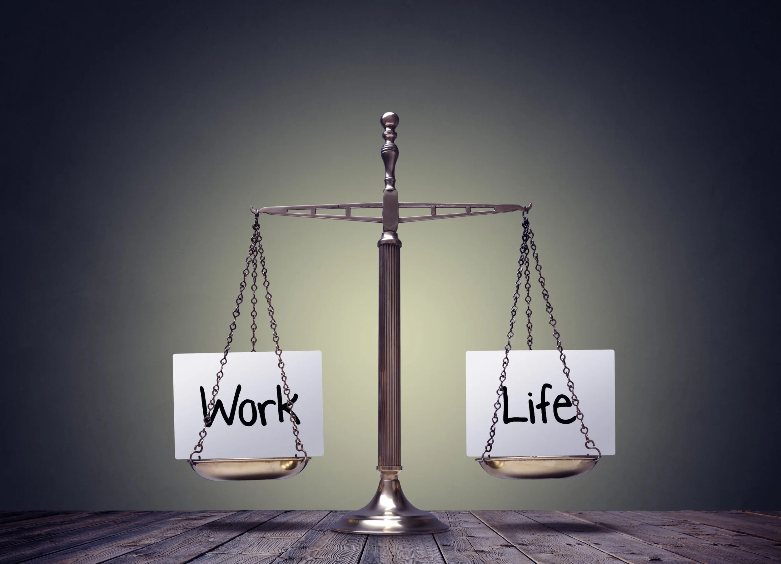 A balanced scale weighing both work and life.