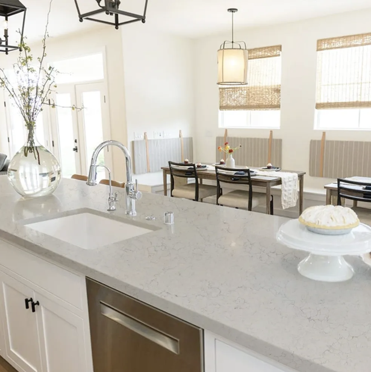 Quartz countertop installation in a modern Owen Sound kitchen with full backsplash and cabinetry