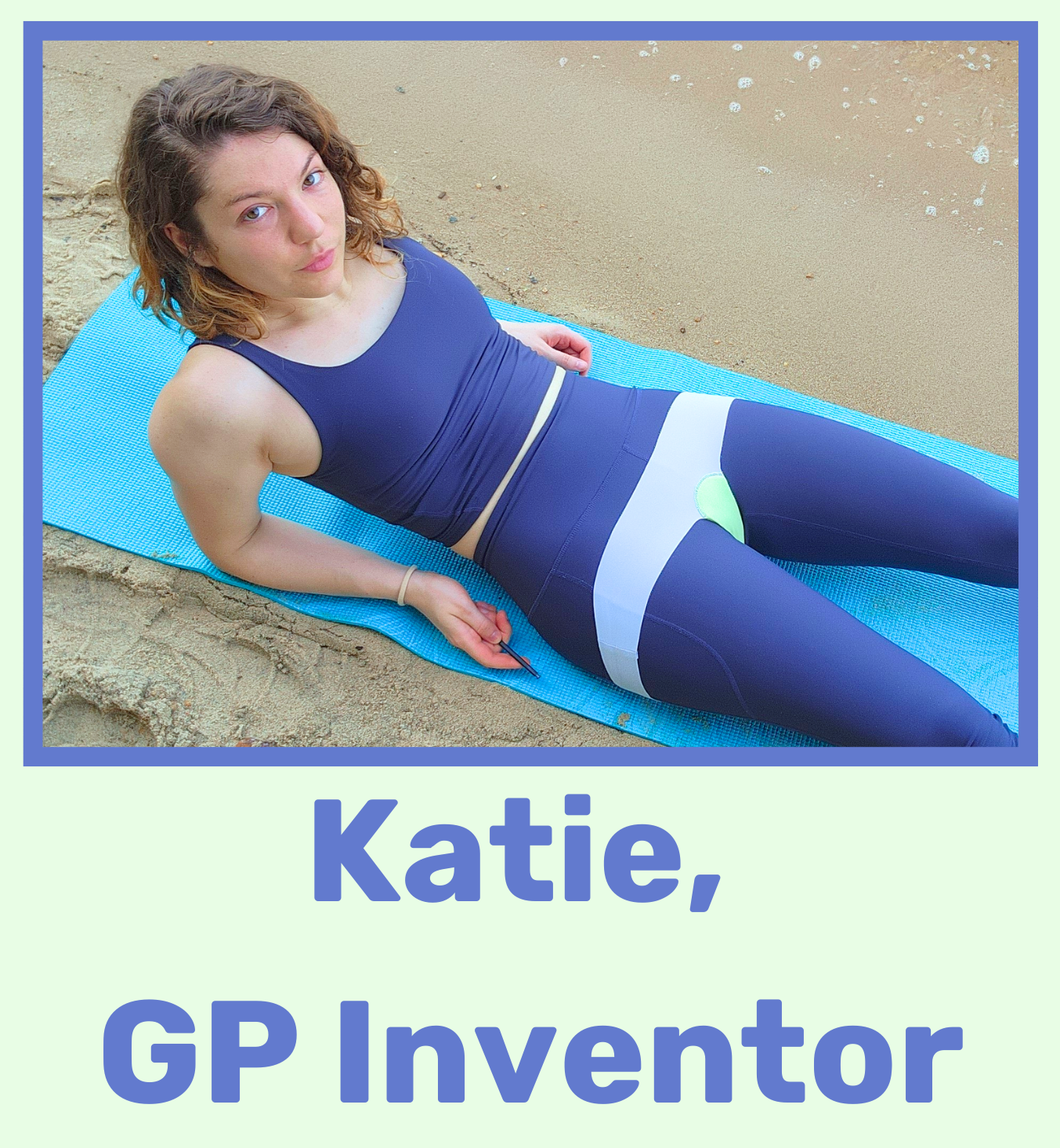 A woman with curly hair lying on a blue mat on the beach, wearing athletic clothing, holding a phone in her right hand.