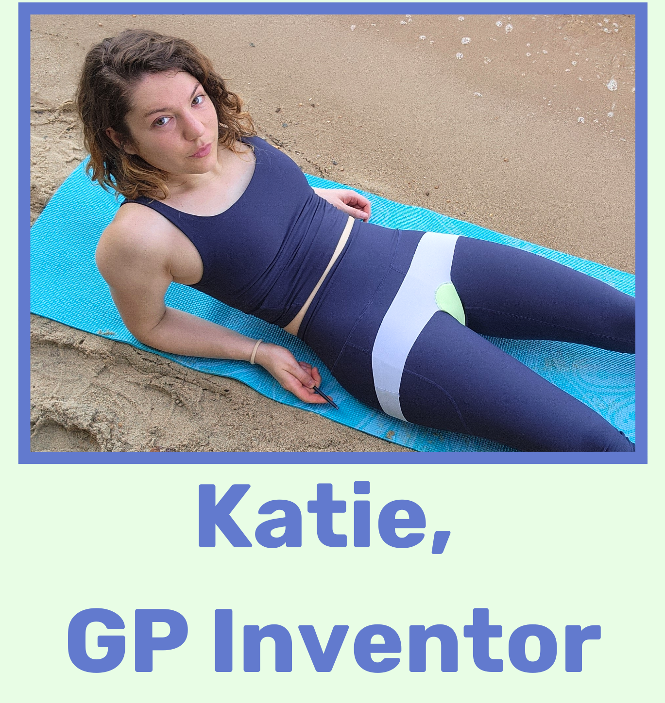 A woman lying on a blue yoga mat on a sandy beach, wearing a navy blue sports outfit with white and green accents, looking at the camera.