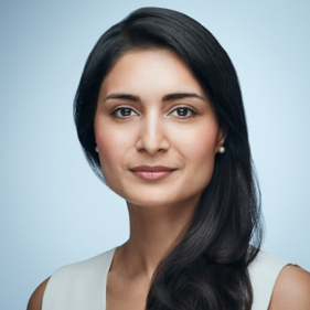 Headshot of a woman staring at the camera on a light blue background