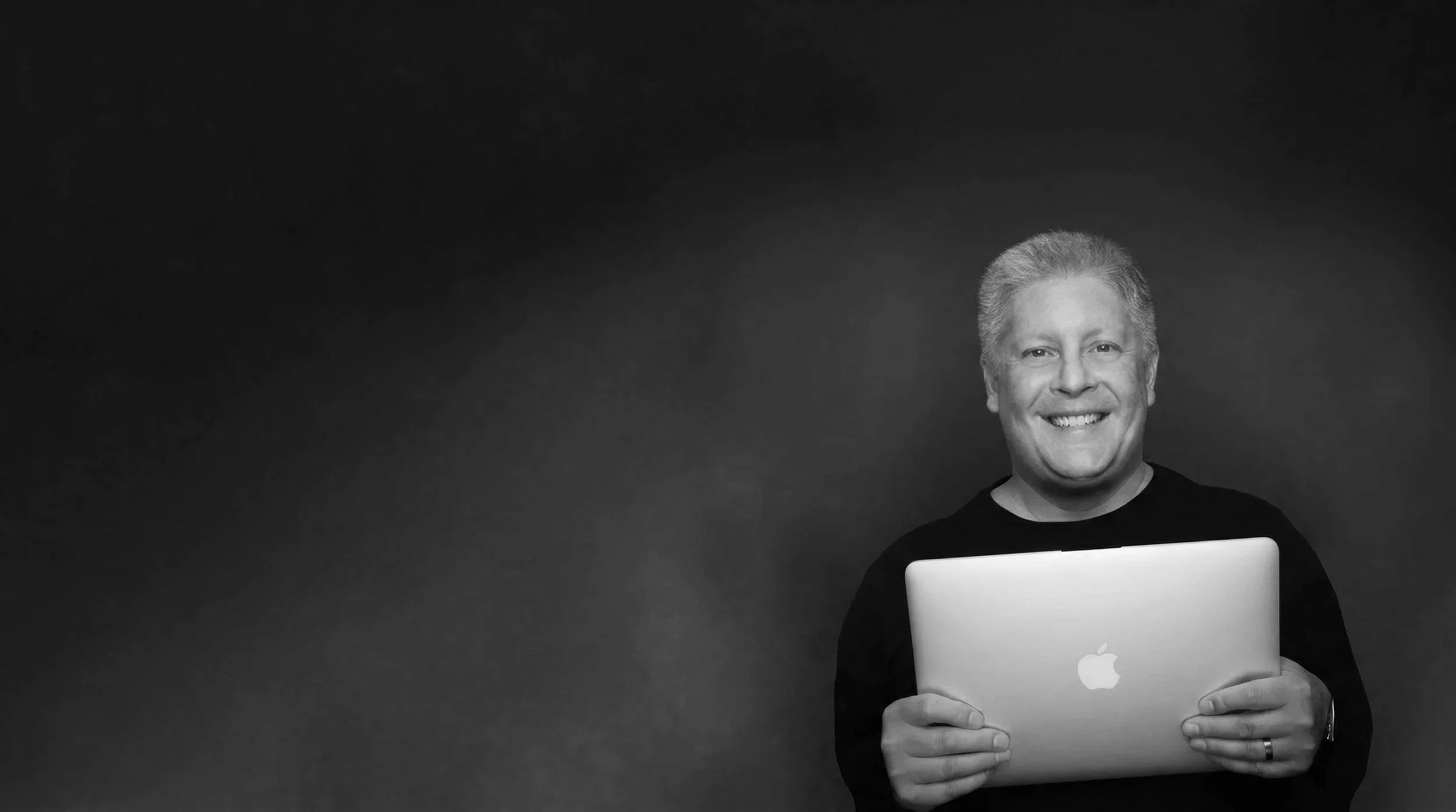 Jim Holding MacBook