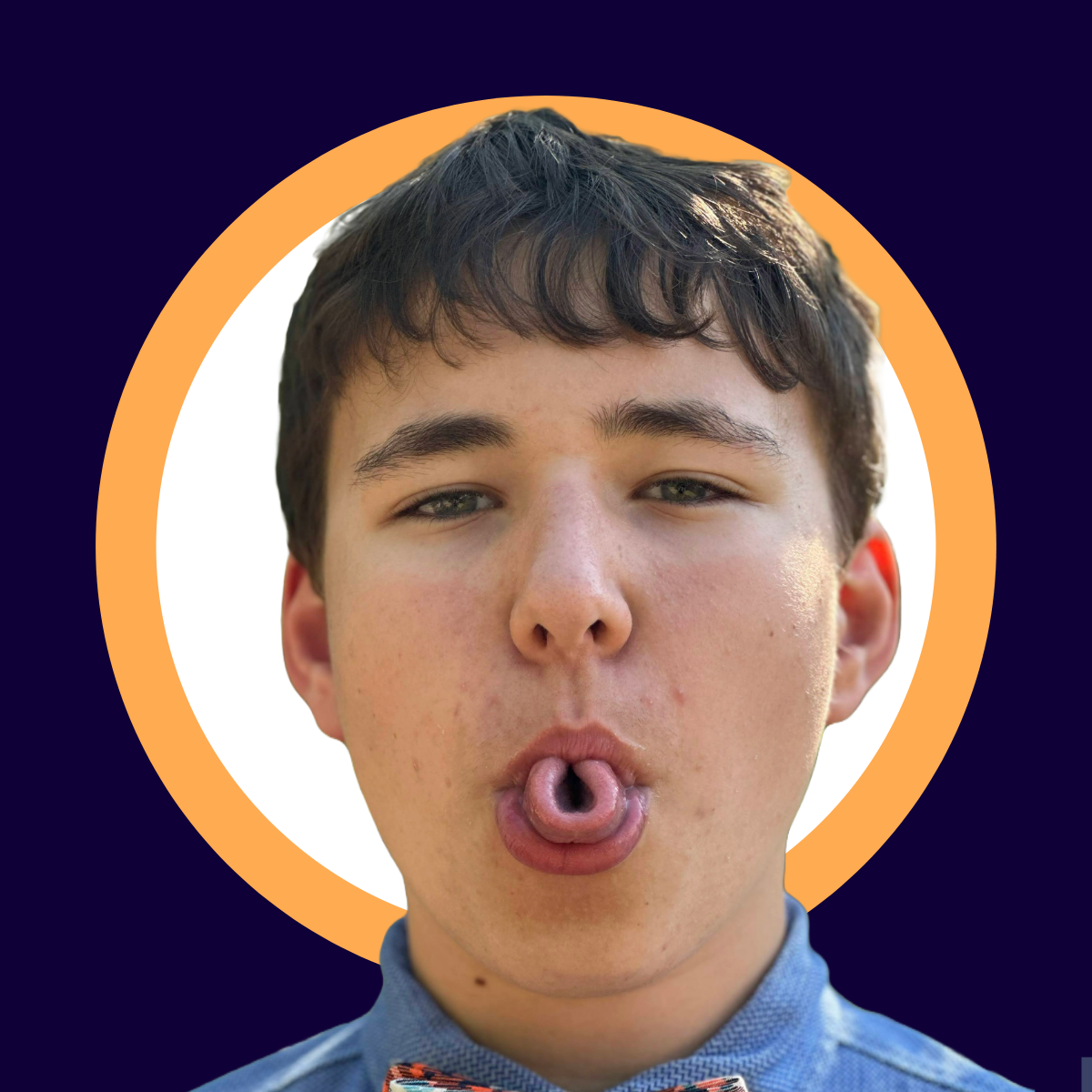 Young man with short dark brown hair, wearing a blue shirt and an orange bow tie, making a playful expression by rolling his tongue, framed within a circular orange border on a dark blue background.