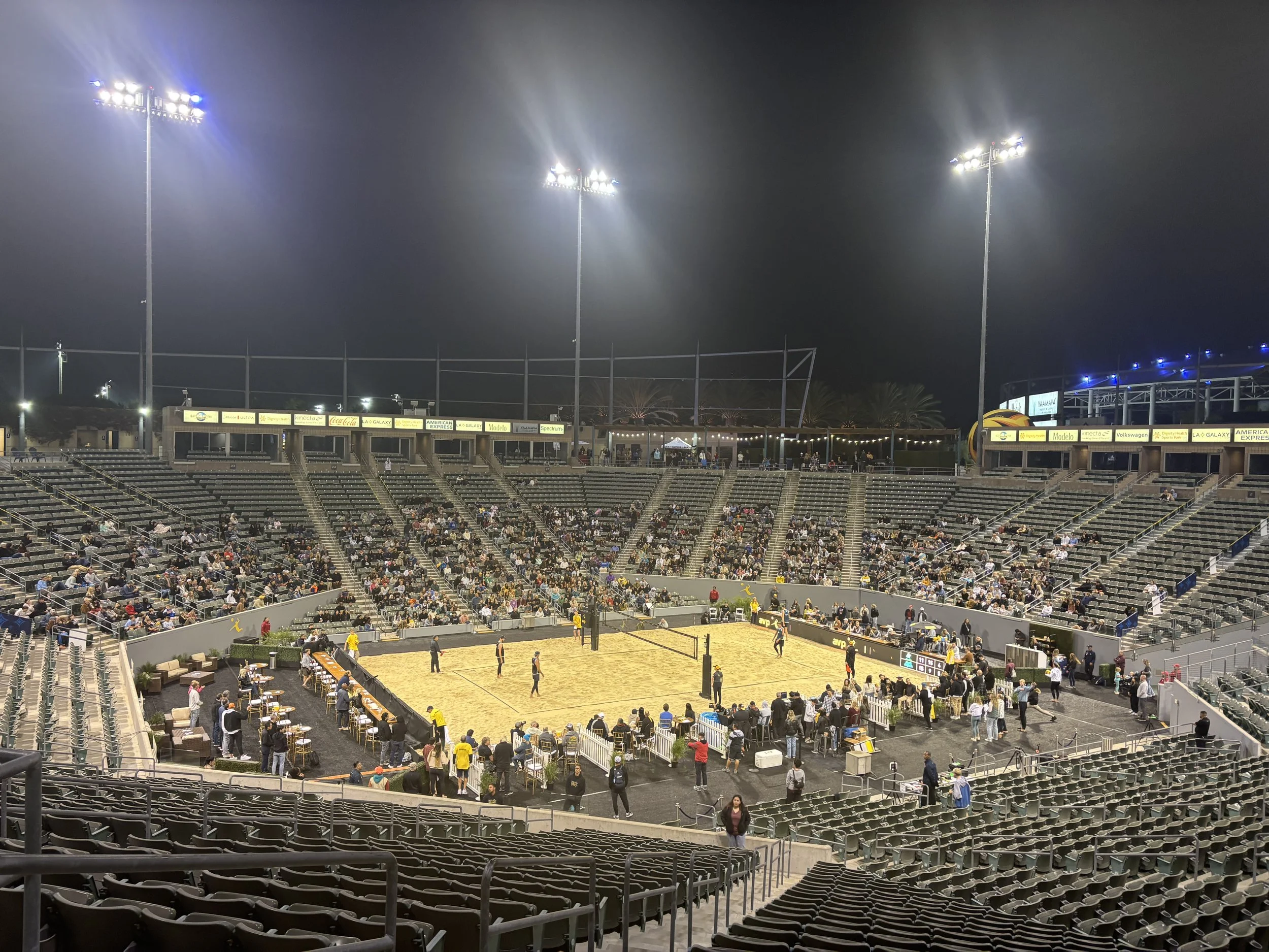 AVP volleyball court and stadium seating at night