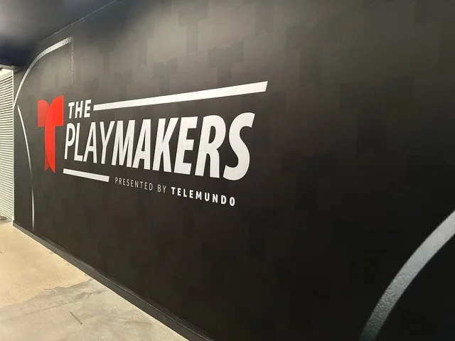The Playmakers branding on an event display