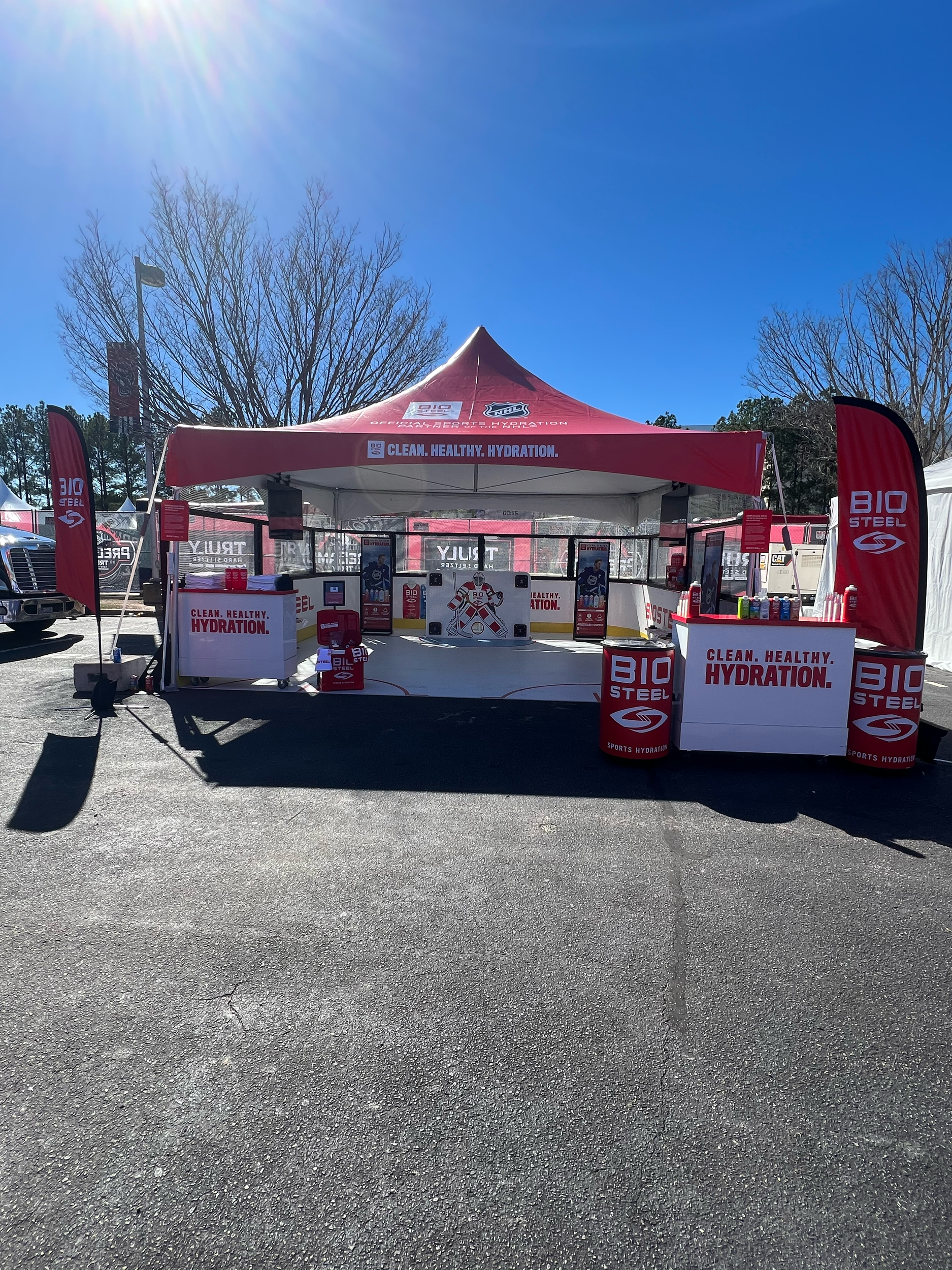 BioSteel hydration activation with a red canopy and product sampling counters.
