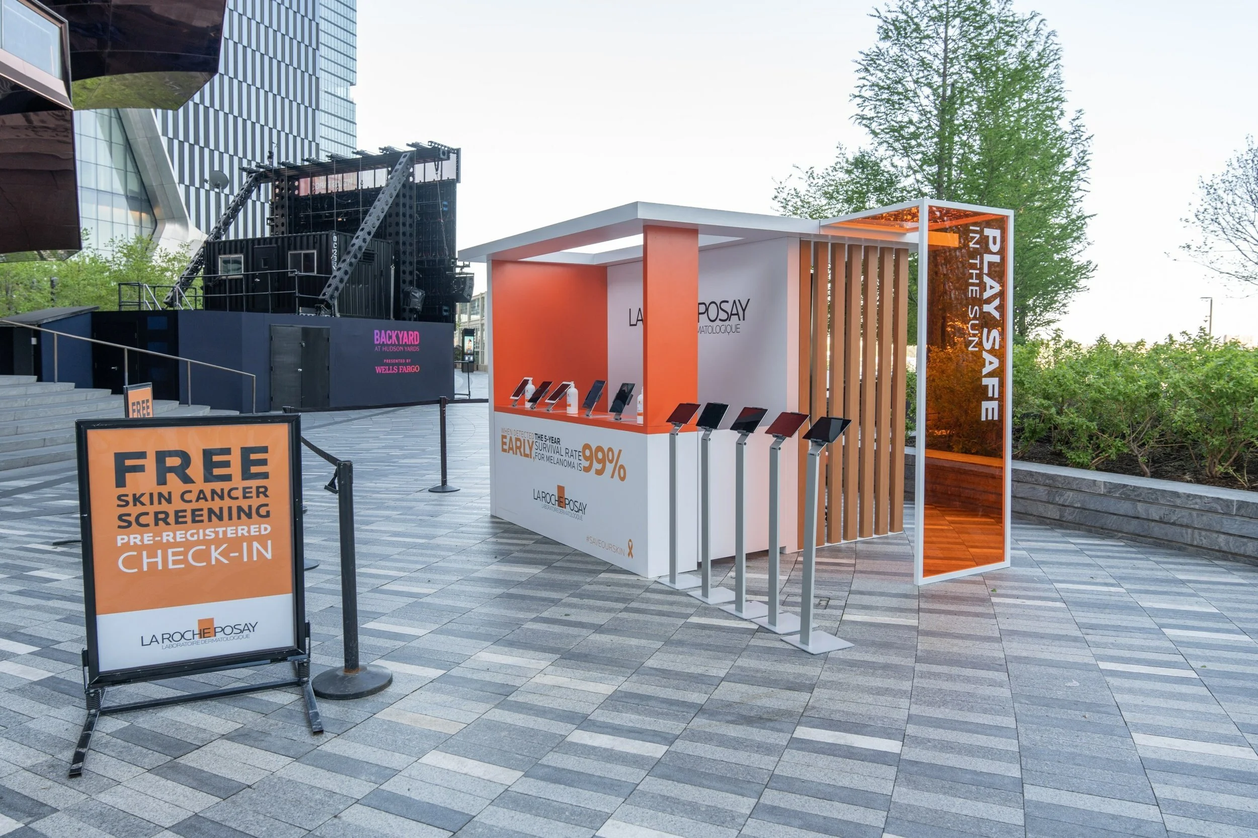 La Roche-Posay skin-screening check-in booth with tablets and registration signage