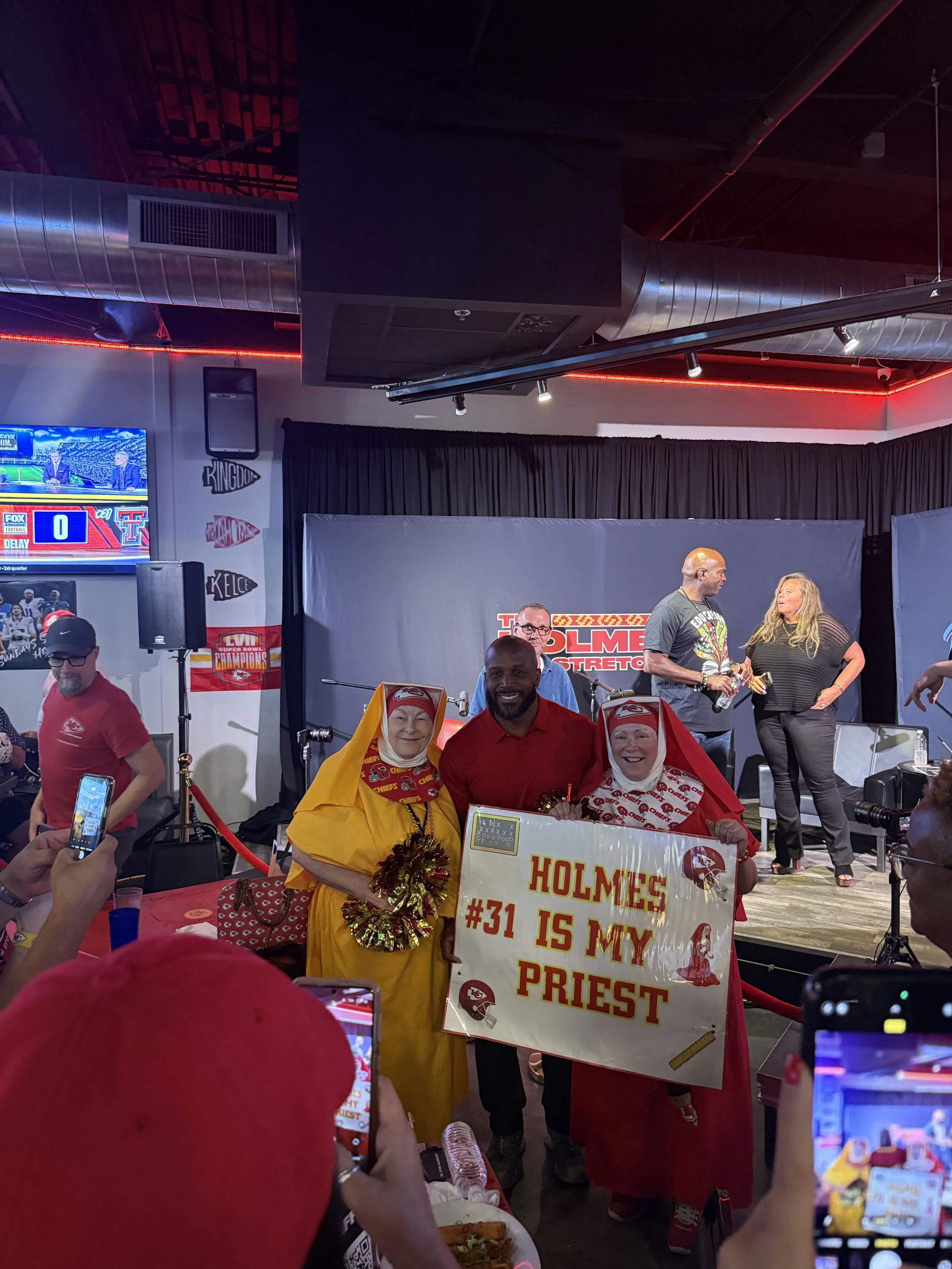 Audience watching a live recording of The Holmes Stretch podcast