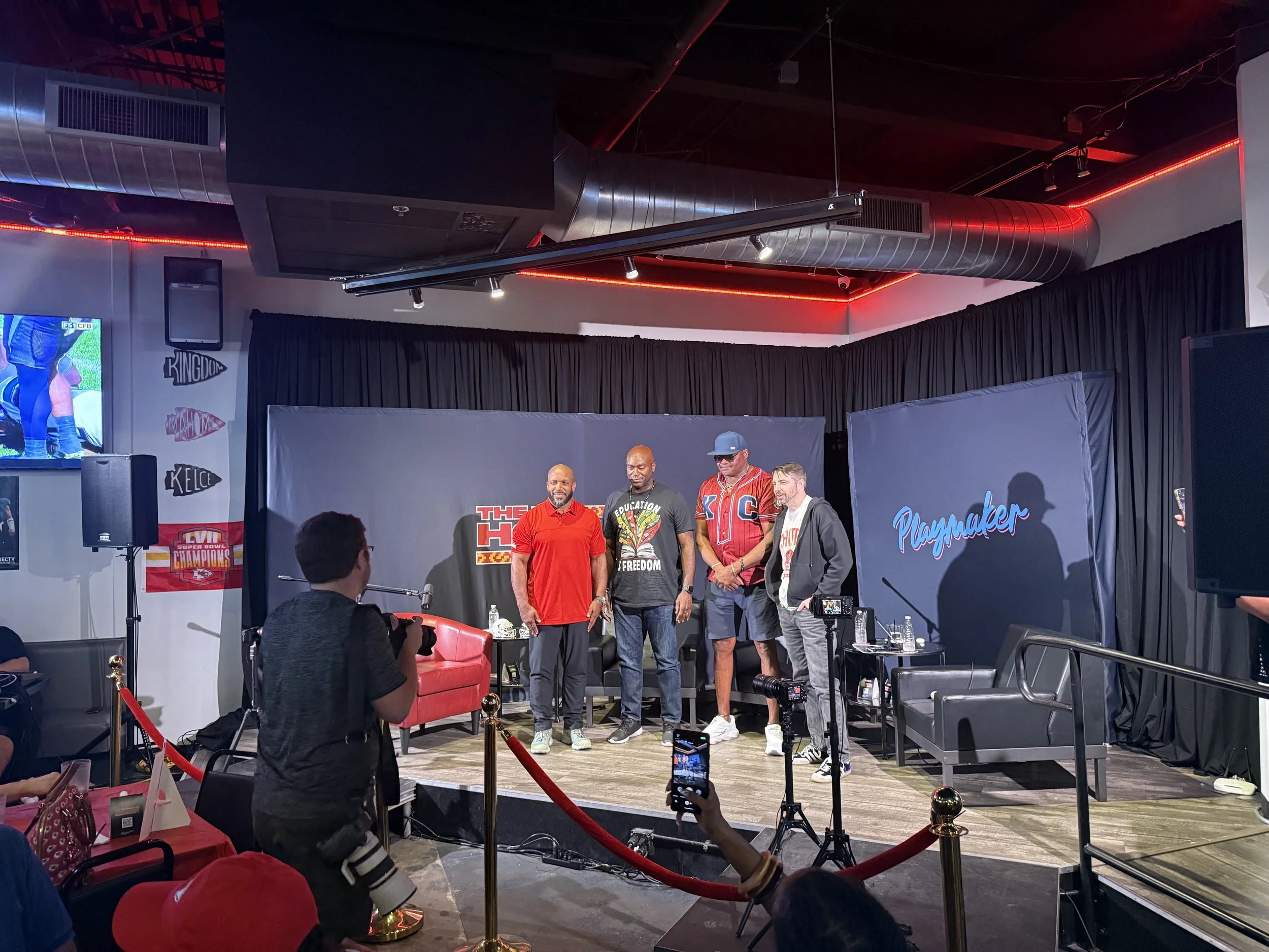 Podcast hosts and guests on The Holmes Stretch stage