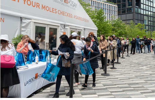 Visitors queuing for the La Roche-Posay SOS Day skin-check activation.