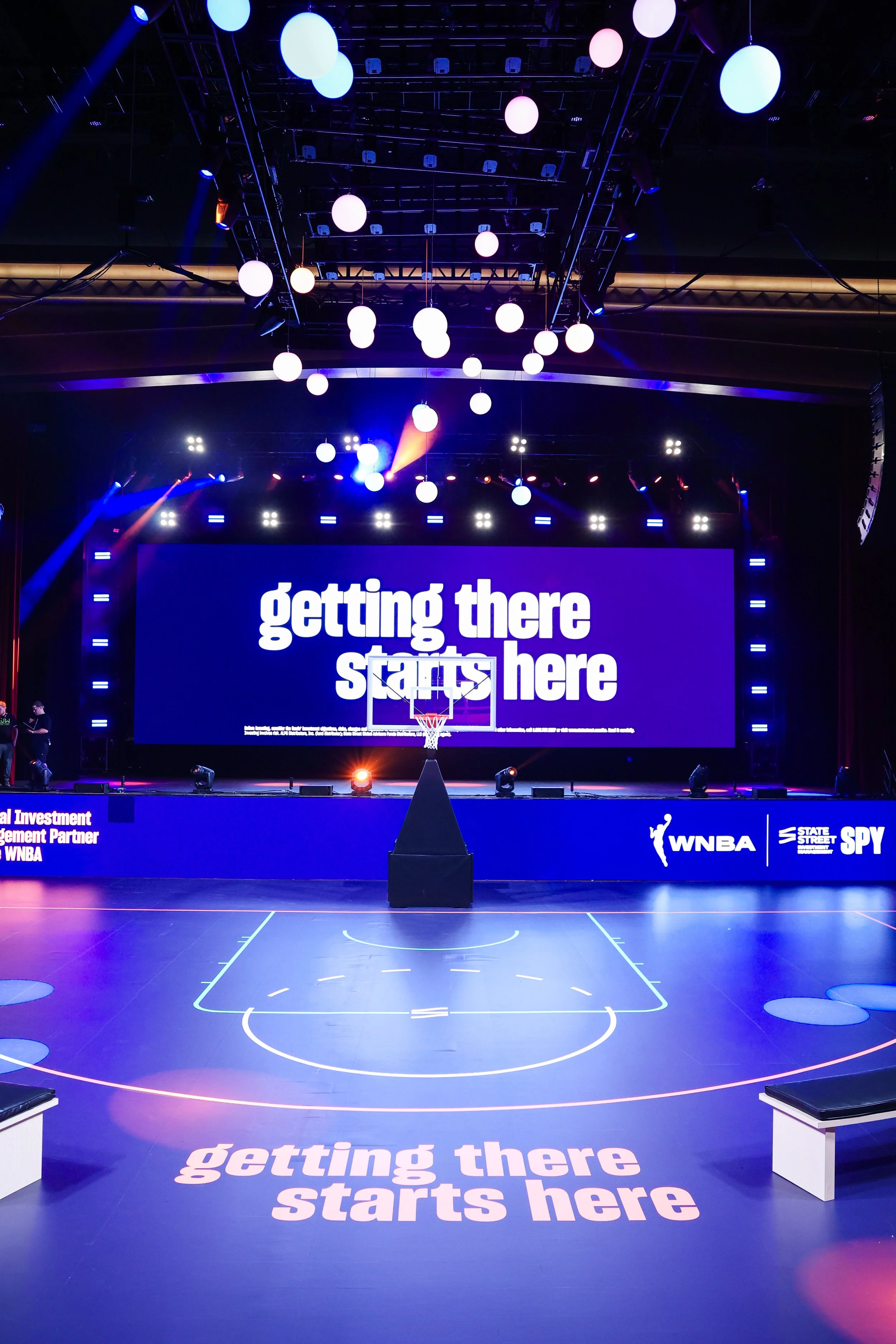 Basketball court and stage under event lighting