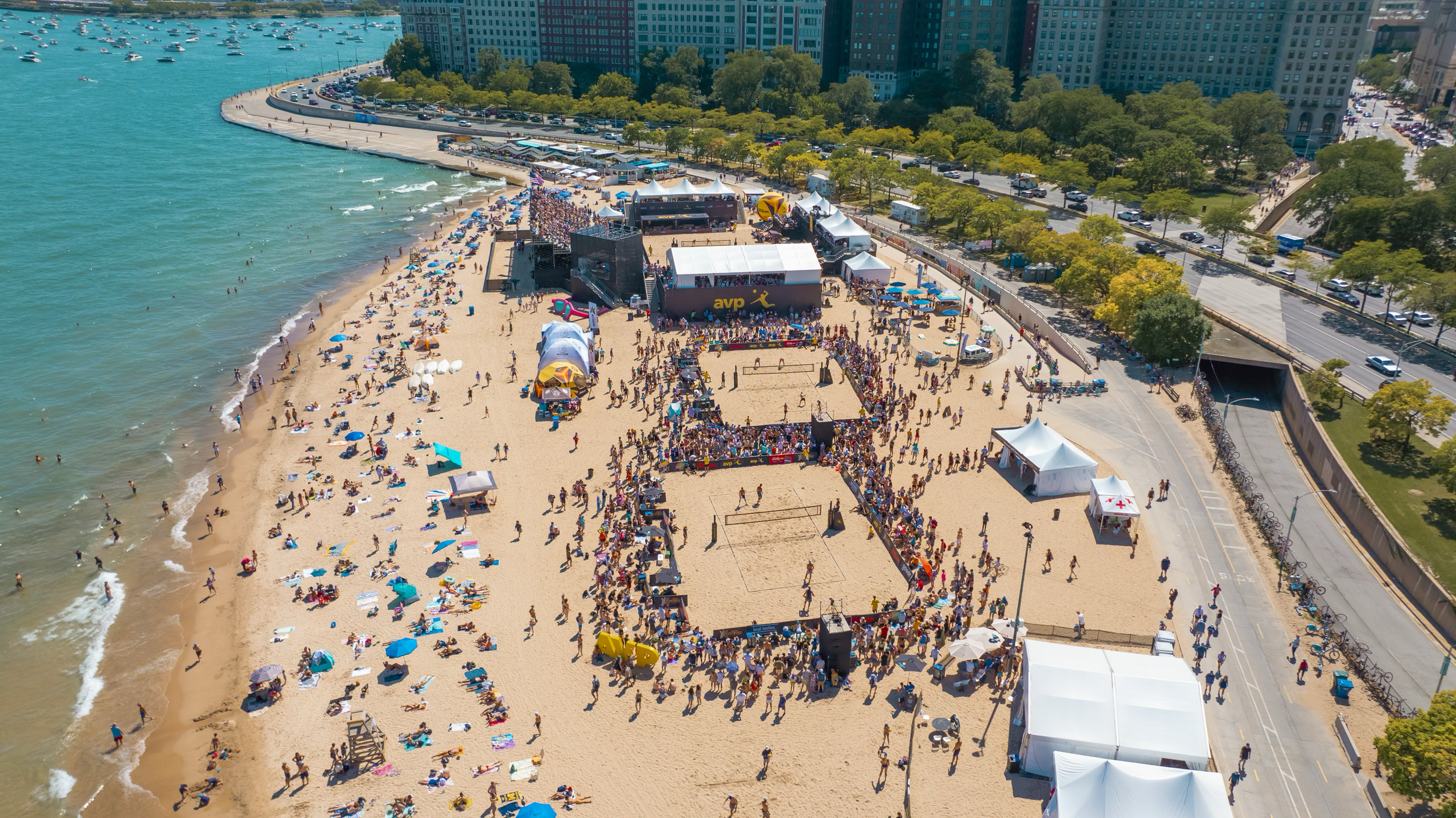 Aerial view of AVP volleyball courts and hospitality structures along the Chicago lakefront