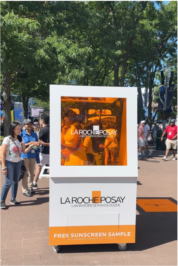 Outdoor La Roche-Posay kiosk offering free sunscreen samples to U.S. Open visitors.