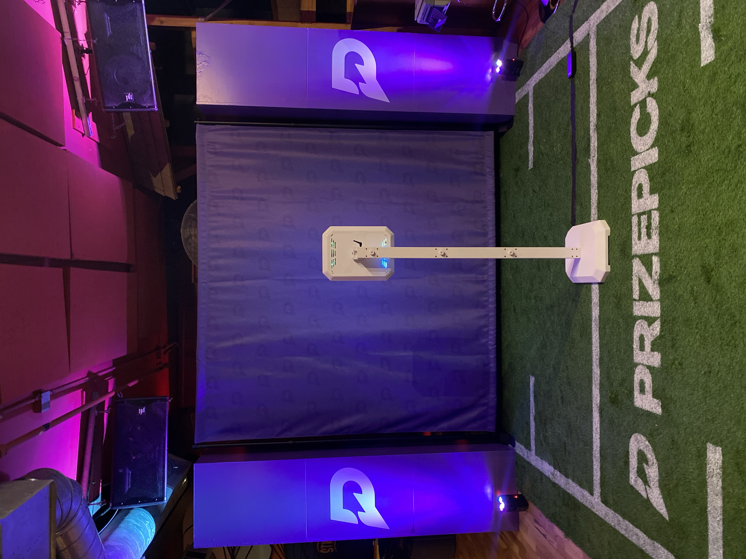 PrizePicks branded football photo activation with turf and goalpost