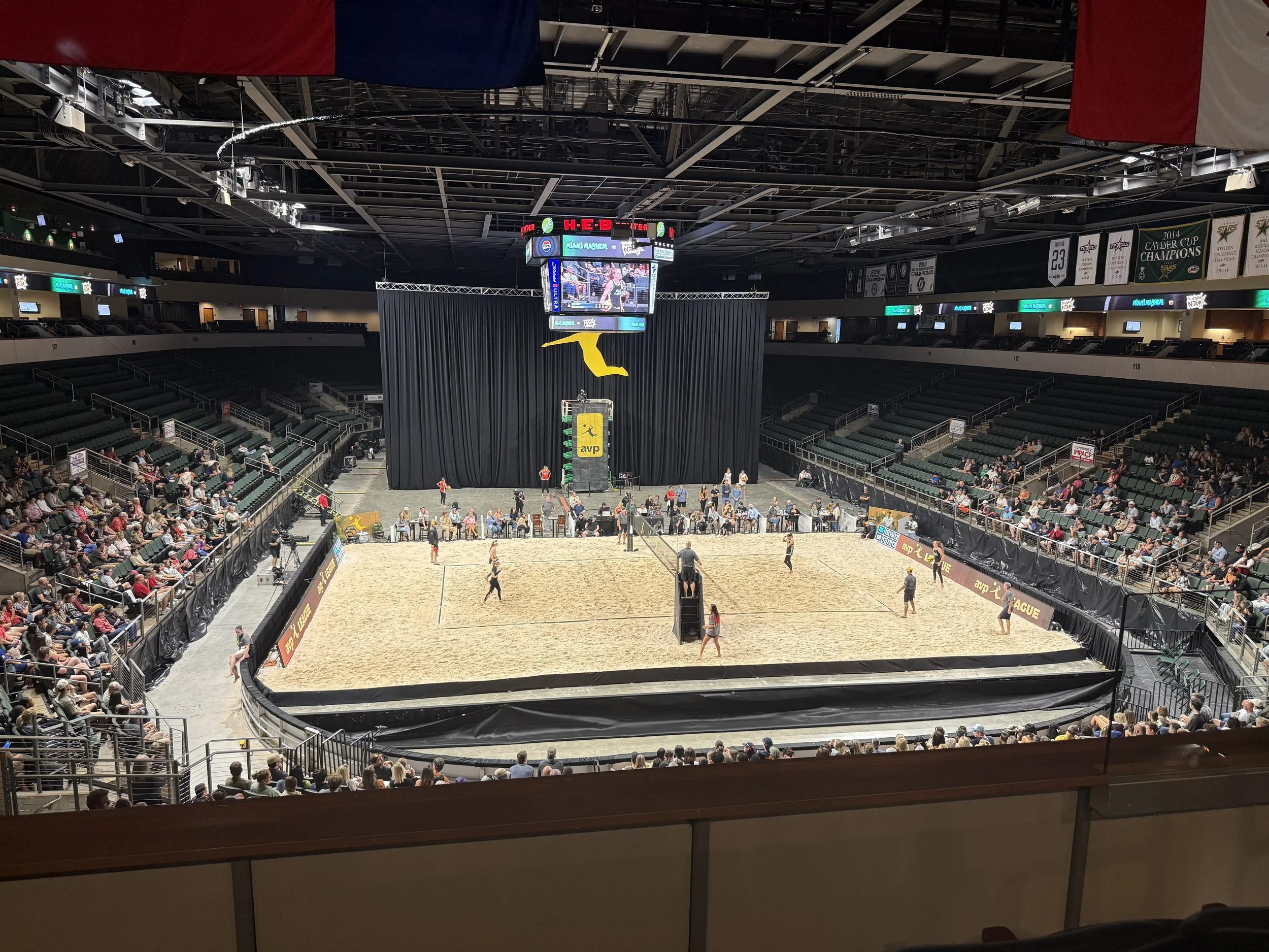 Sand court installation inside an indoor sports arena
