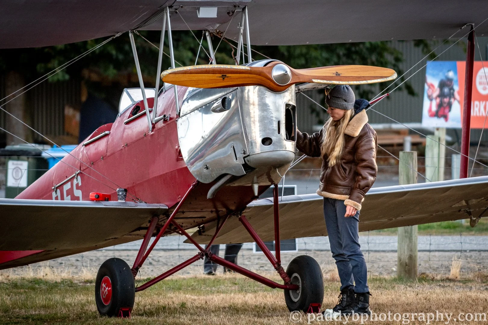 Lucy looks after Legend Aviation DH. 82a Tigermoth "Queenie" during Warbirds over Wanaka 2024
