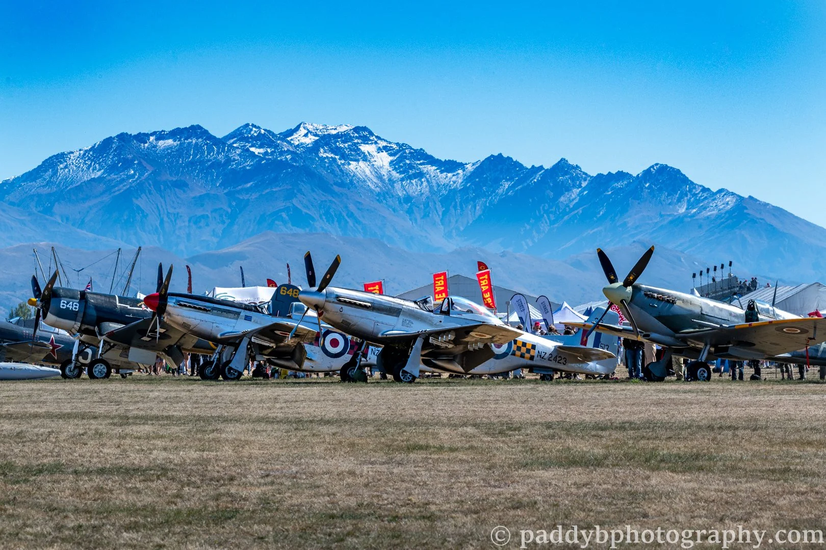 Four classic fighters in front of the Southern Alps during Warbirds over Wanaka 2024