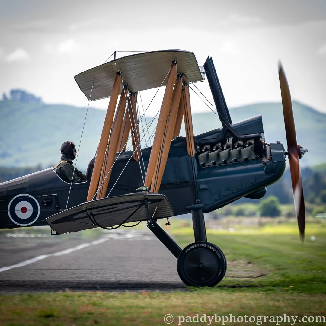 The Vintage Aviator BE-12 crossing the runway in the mid-morning sun at Hood Aerodrome, Masterton NZ