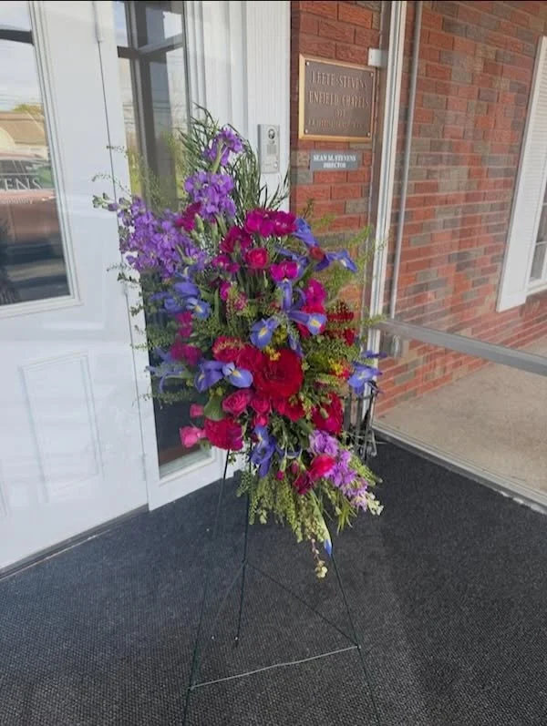 Leete-Stevens Enfield Chapels. 🕊️Designing for families means putting our personal preferences aside to honor theirs. This vibrant mix of crimson and purple was a specific request to celebrate a life full of color. It is a privilege to provide that 