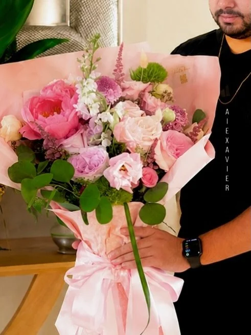 From Studio to Celebration ✨
A masterfully curated blend of soft blush, deep textures, and artisanal greens from our design studio.
Every step of the journey is personal&mdash;from the moment Alexavier finishes wrapping the fresh arrangement, to the 
