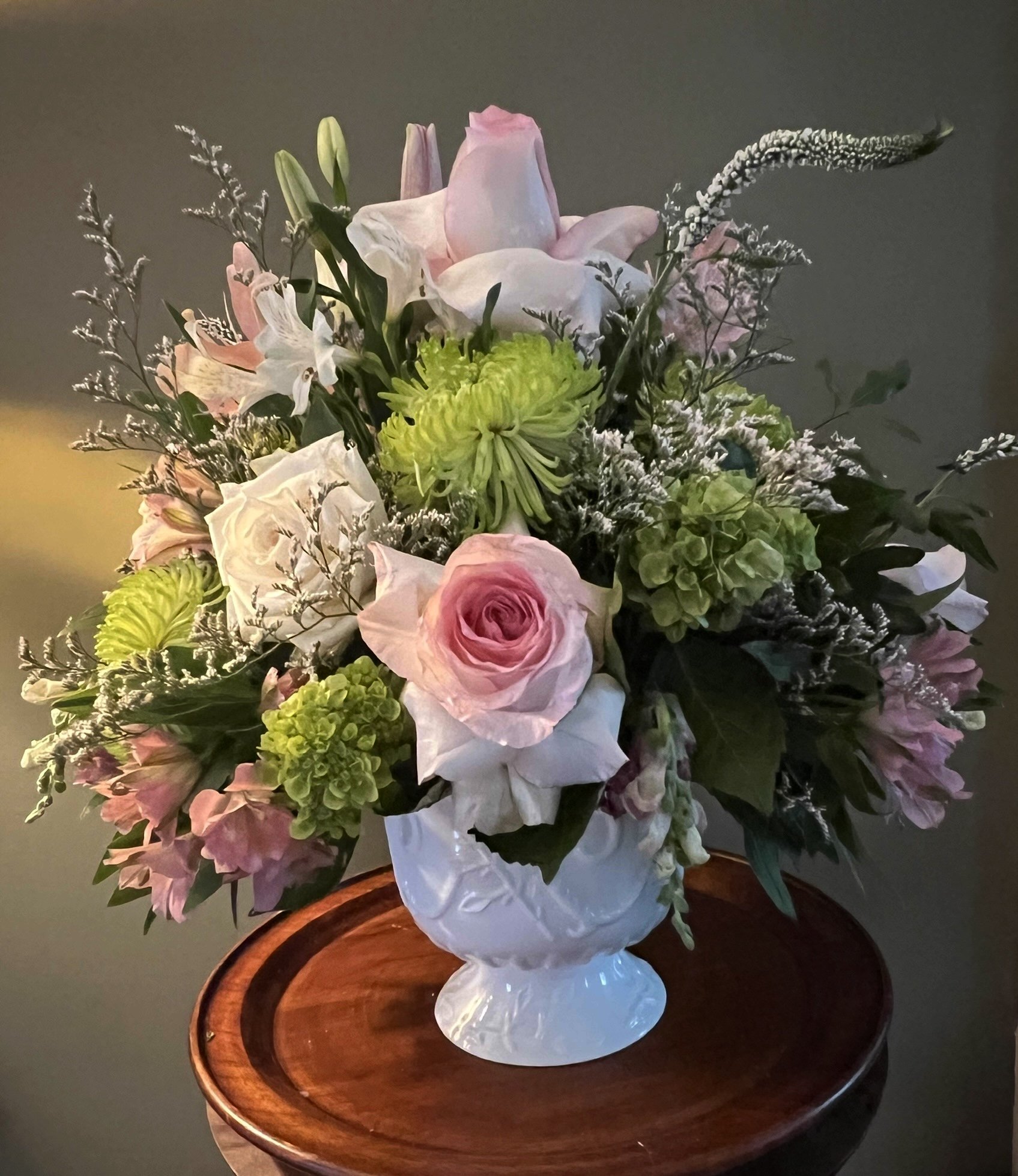 A designer’s choice sympathy arrangement in soft pastel tones, thoughtfully created to offer comfort and peace.