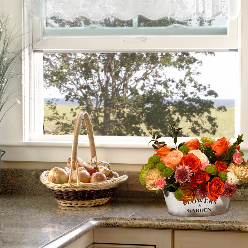 Seasonal or Designers Choice Garden Tin Arrangement. Available for Express Blooms delivery to Agawam and surrounding towns in MA & CT. Enoy these Every Day Comfort within your home today!