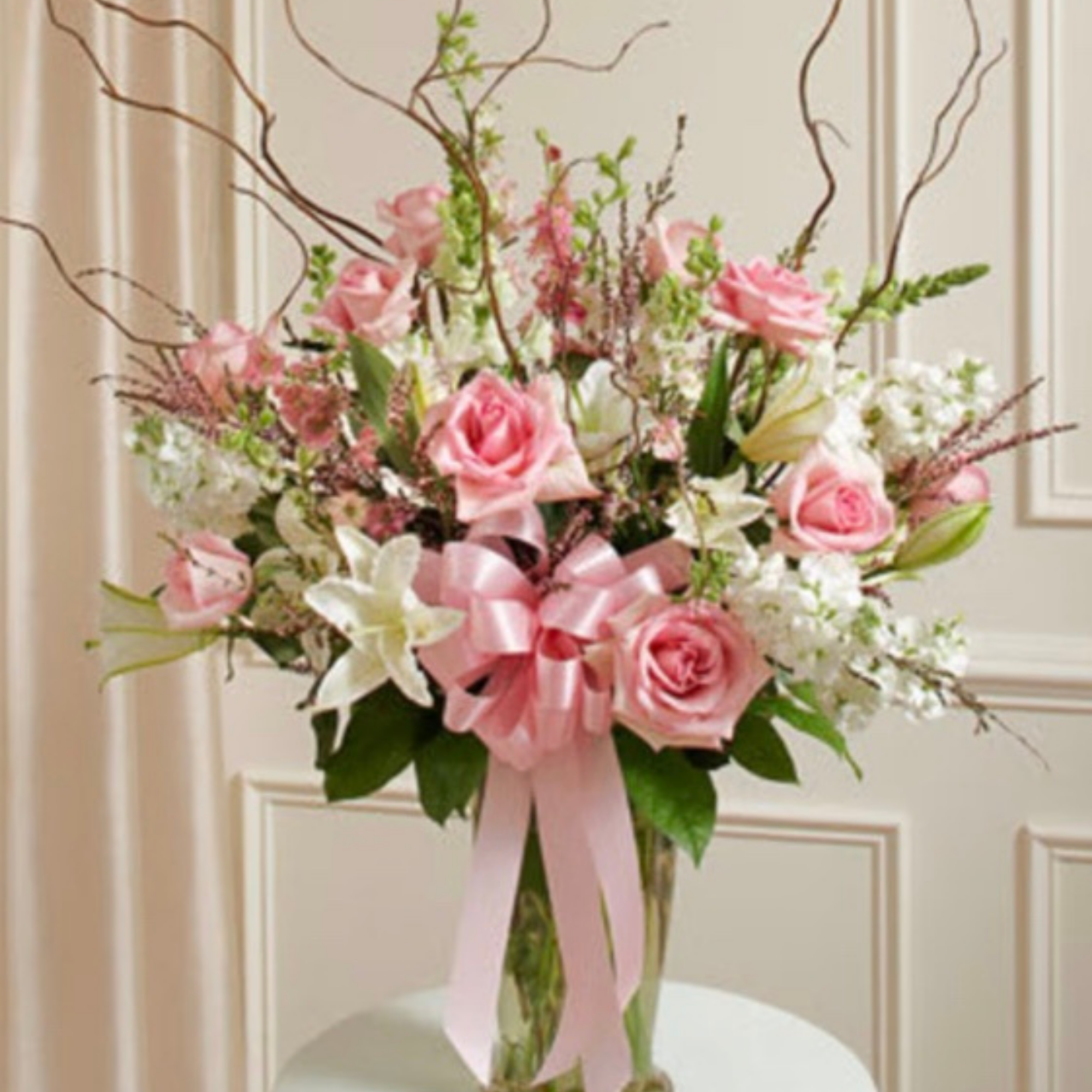 Modern sympathy floral design featuring premium blooms such as anthurium and orchid, shown as studio design inspiration.