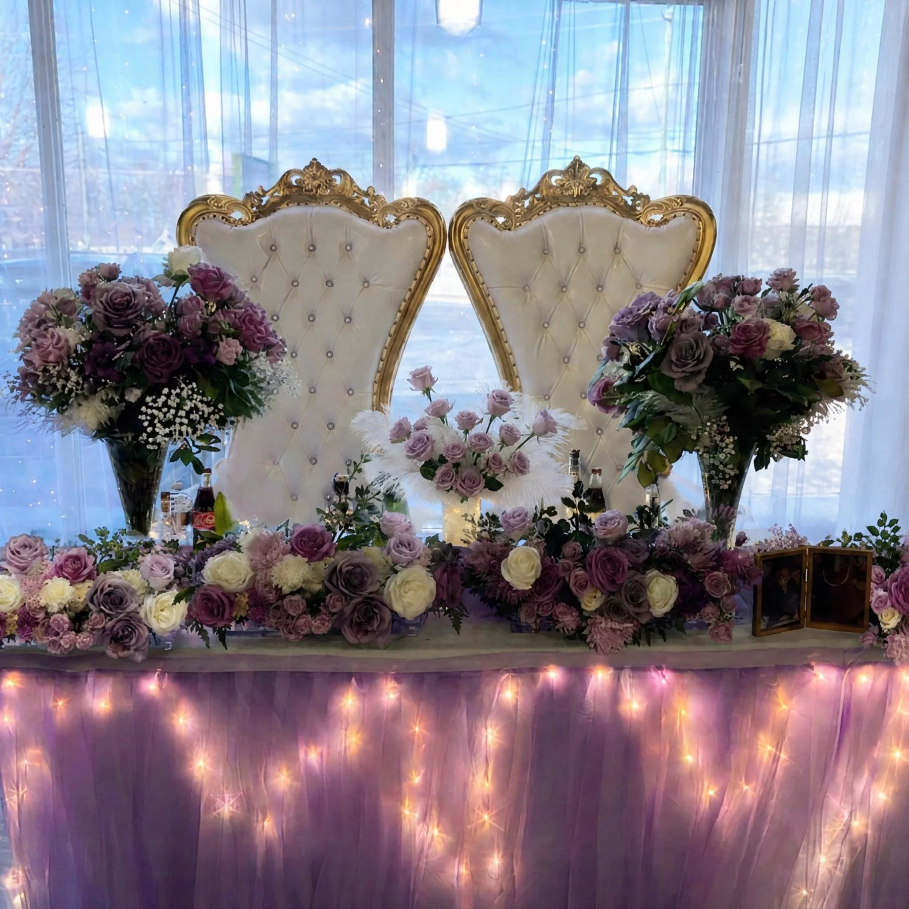 Elegant wedding or event reception table decorated with numerous pink, purple, and white roses, flower arrangements, by Gifts of Flowers TA, located in Feeding Hills, MA.