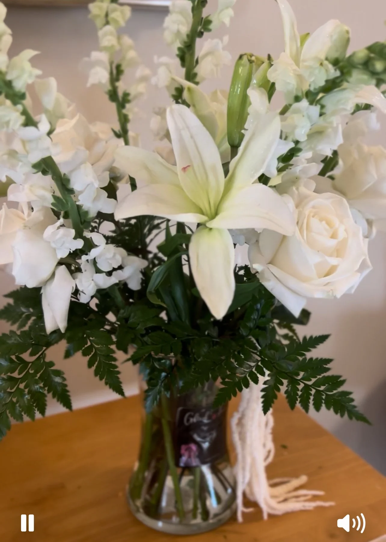 Elegant whitle liles, white roses and white Snapdragons with leather leaf and dried white Amaranth's