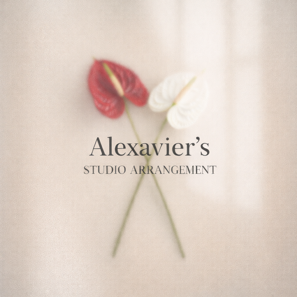 Elegant cover photo with two anthurium flowers, one red and one white, crossed on a soft beige background, with the text 'Alexavier's Studio Arrangement' in the center.