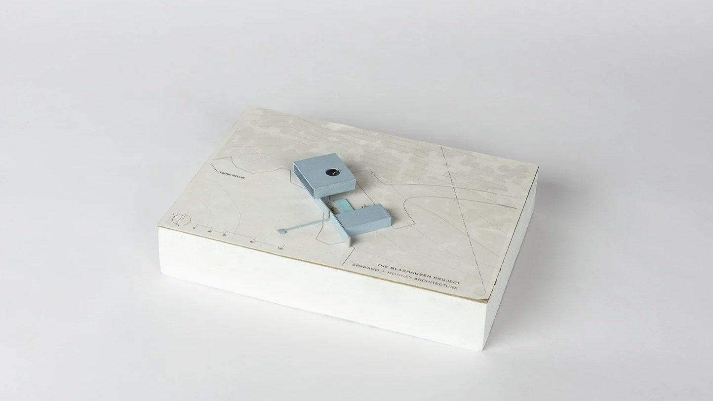 Glashausen architectural scale model of two rectangular building masses separated by an exterior pool and courtyard designed by Sparano + Mooney Architecture