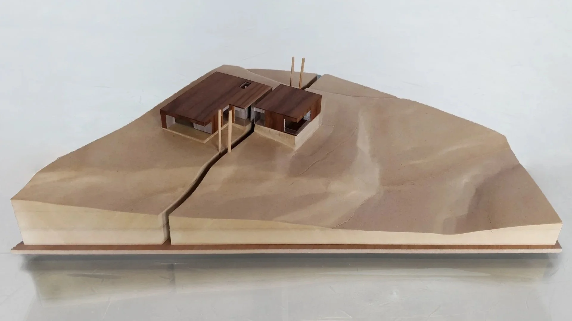 Emigration Creek Residence physical site architectural model with a section slice through the middle, designed by Sparano + Mooney Architecture
