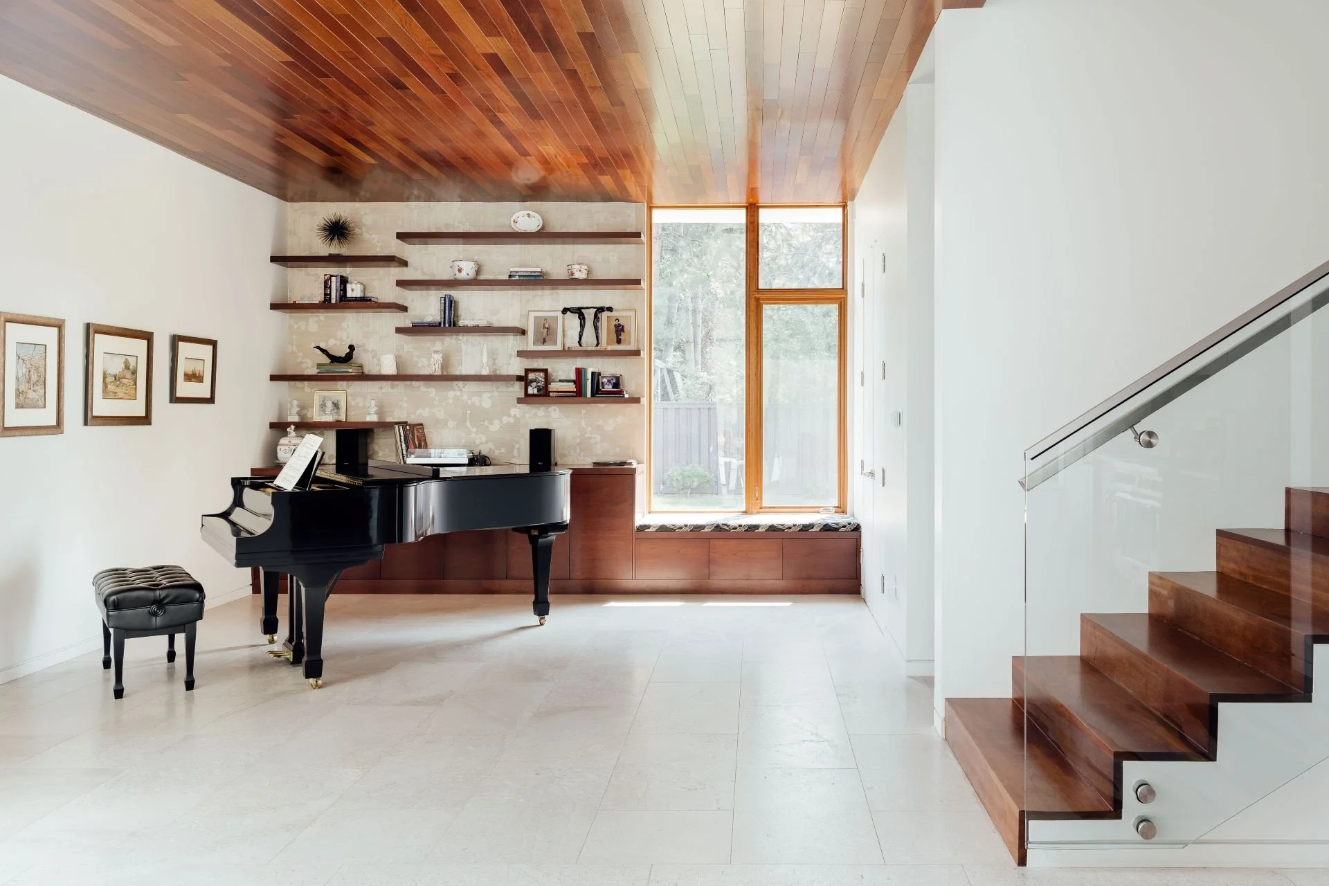 Grand piano, tile flooring and wood ceiling of music room designed by Sparano + Mooney Architecture.