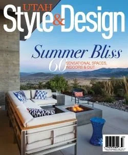 Cover of Utah Style & Design magazine featuring an outdoor patio with seating, a fire pit, and a scenic landscape view of mountains and water in the background.