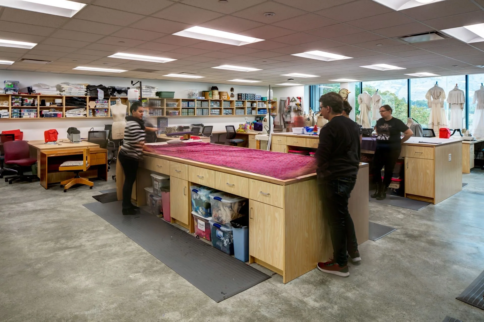 Students in Sid Perkes Theatrical Design Complex fabric workshop for theatrical costume production designed by Sparano + Mooney Architecture