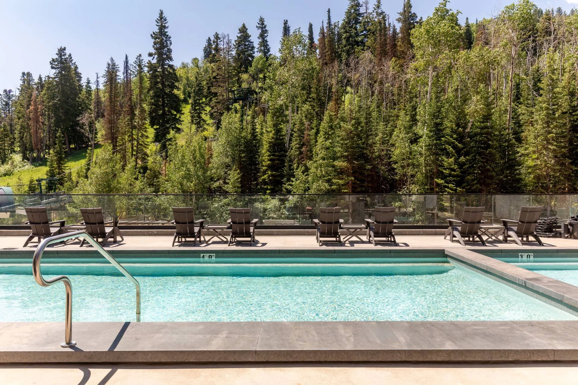 Expansive Park City mountain views above pool designed by Sparano + Mooney Architecture