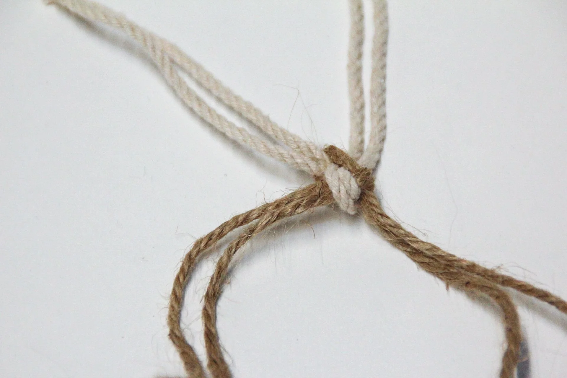 Intertwined knotted white and brown twine as concept for residence designed by Sparano + Mooney Architecture