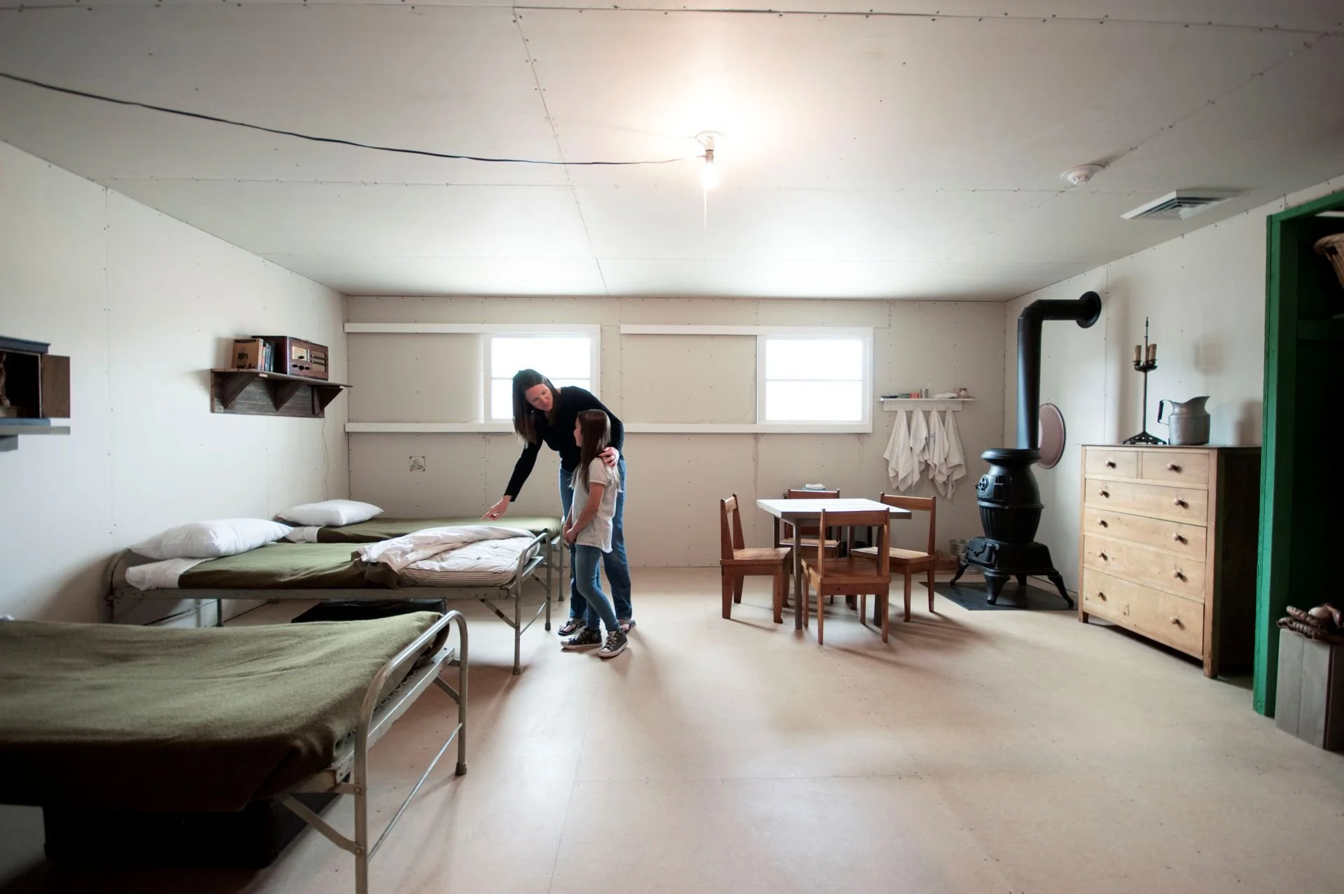 Mother and daughter in Topaz Museum barrack designed by Sparano + Mooney Architecture