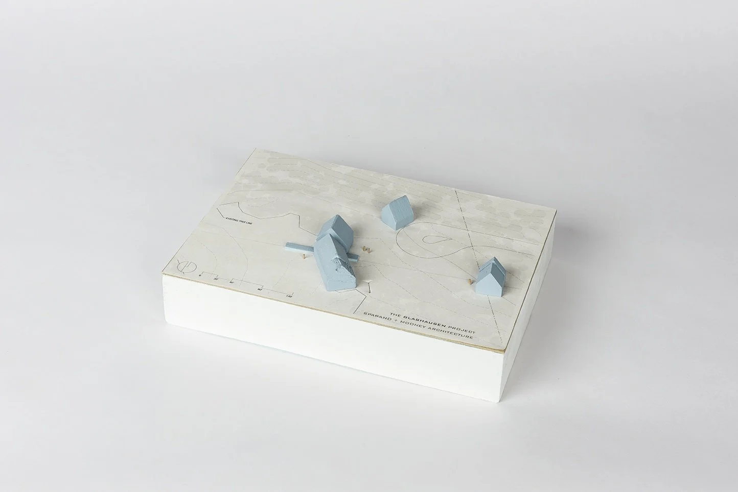 Glashausen architectural scale model with multiple gabled masses across a site designed by Sparano + Mooney Architecture