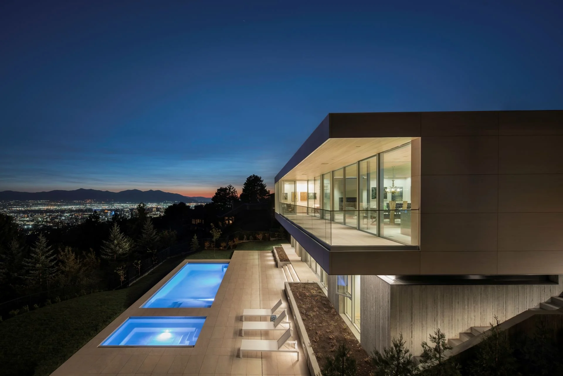Salt Lake City Oikos Residence exterior at night designed by Sparano + Mooney Architecture
